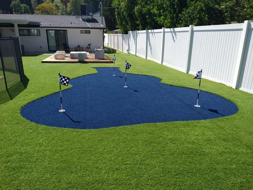 Blue backyard putting green and artificial turf installation in Lake Balboa by Option 1 Builders