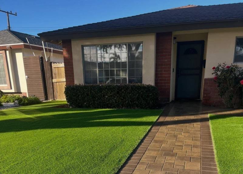 Full yard landscape with turf and hardscape